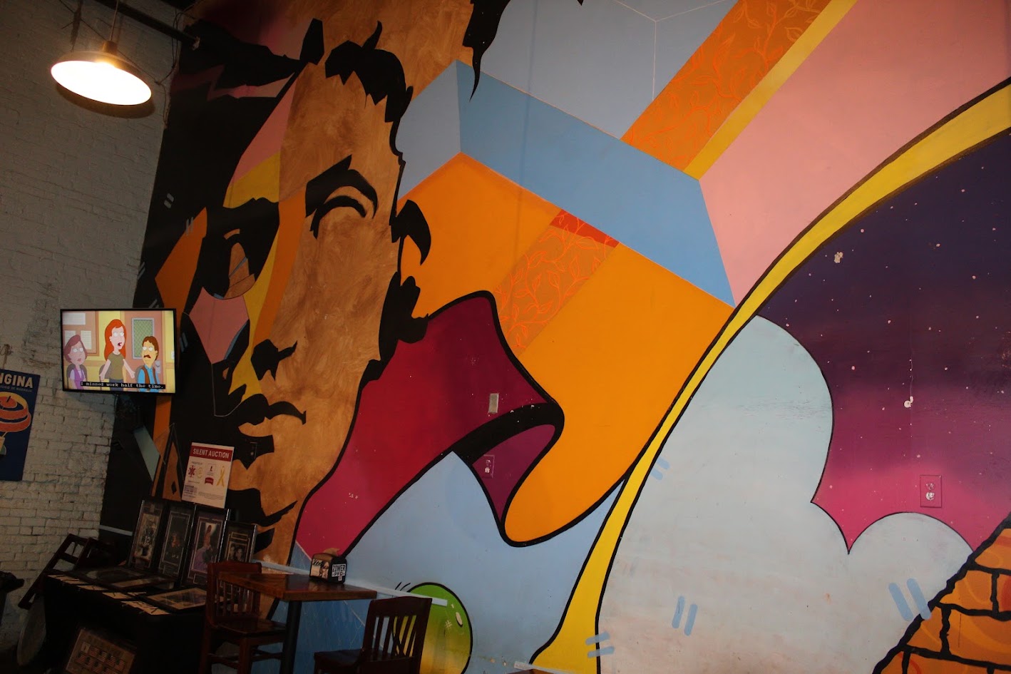 Colorful wall mural inside Benny Pennello's in NoDa
