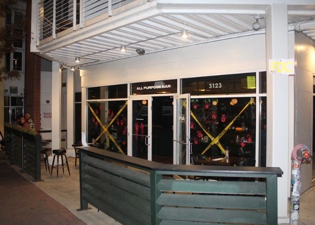 All Purpose Bar exterior and nighttime activity in NoDa Charlotte