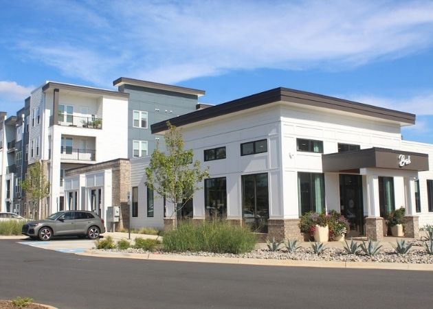 Exterior view and rental office at Bask Apartments in Steele Creek Charlotte