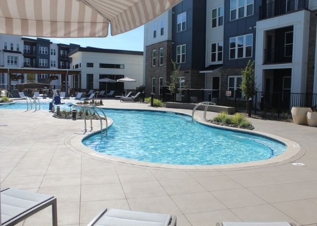 Outdoor pool deck at Bask Apartments in Steele Creek Charlotte