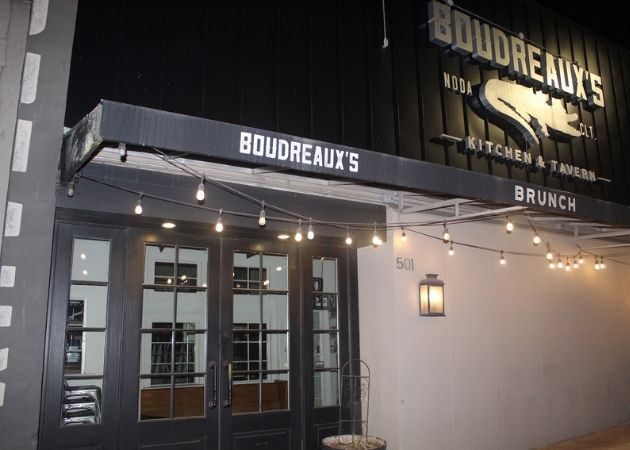 Boudreaux's Kitchen and Tavern NoDa Charlotte storefront at night