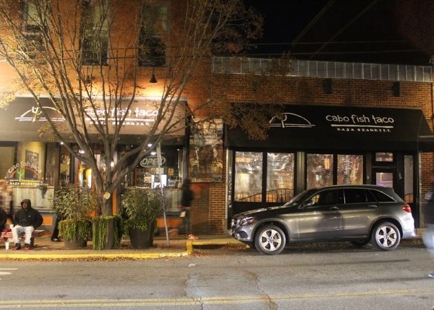Cabo Fish Taco Baja Seagrill storefront in NoDa Charlotte at night