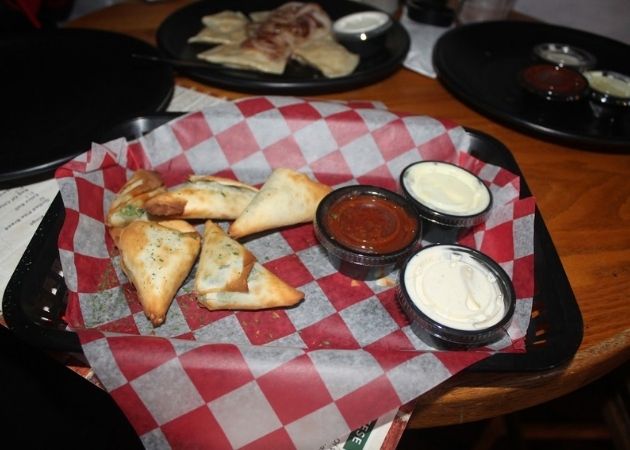 Baked spinach footballs at Carmella's Pizza Grill