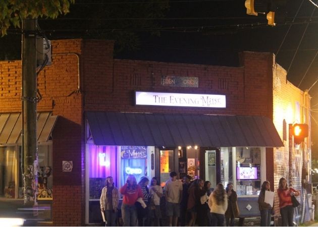 The Evening Muse live music venue with guests outside at night in NoDa Charlotte