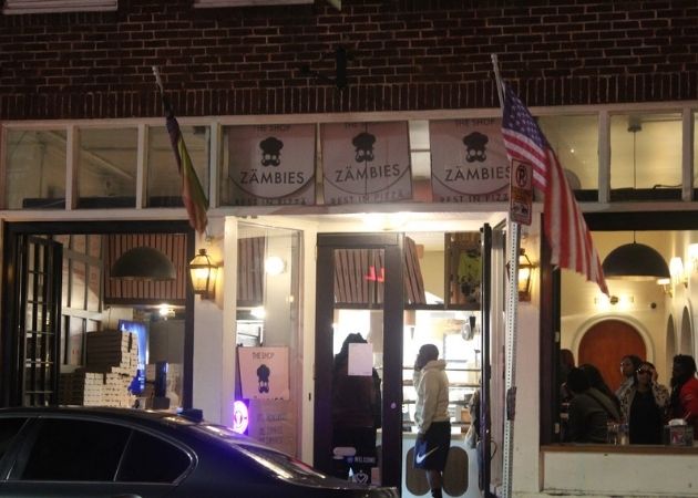 Zämbies Pizza shop in NoDa Charlotte with nighttime customers